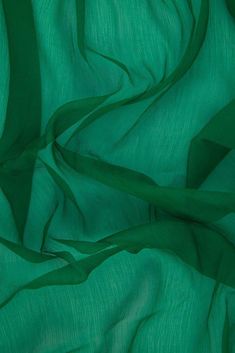 Jelly Bean Green Silk Crinkled Chiffon Fabric is a lightweight fabric with a pronounced crinkled texture running lengthwise down the fabric. The word "chiffon" is French in origin and means "cloth". Our Silk Crinkled Chiffon comes in a wide range of colors, and it is utilized for bridal, eveningwear, overlays, lingerie, pants, blouses. Purchase fabric by the Yard at NY Designer Fabrics. The fabric measures 42 inches in width. Whimsical Halloween, Jelly Bean, Chiffon Material, Sheer Material, Green Silk, Jelly Beans, Green Fabric, Chiffon Fabric, Hunter Green