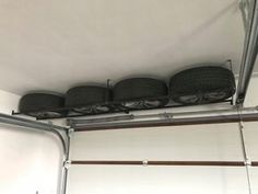 there are four tires hanging from the ceiling