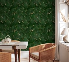 a dining room with green wallpaper and wicker chairs in front of a white table