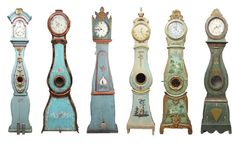 an assortment of old clocks in different colors