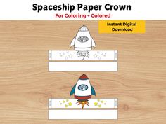 an image of a paper crown with a rocket ship on it and stars in the background