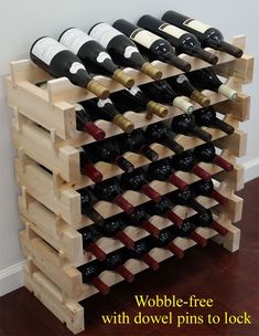 a wooden wine rack filled with lots of bottles