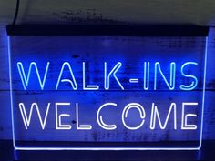 a neon sign that says walk - ins welcome