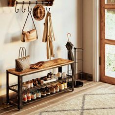 the entryway is clean and organized with shoes, purses, and coat racks