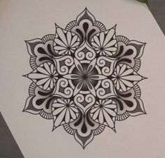 an intricate design is shown on a piece of paper