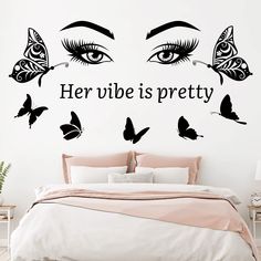 there is a wall decal with butterflies on it that says her vibe is pretty