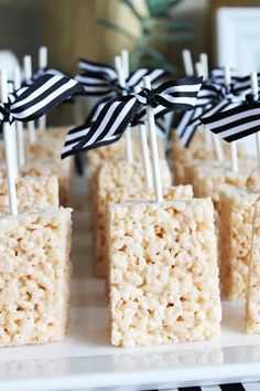 rice krispy treats with black and white bows on them