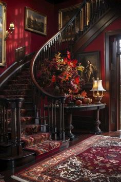 a staircase in a house with red walls and rugs