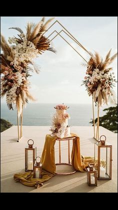 an outdoor wedding setup with flowers, candles and pamolite on the side table