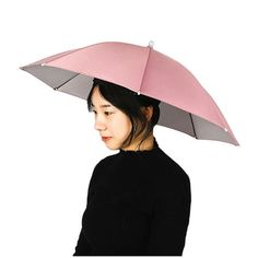 a woman with an umbrella hat on her head