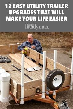 a man sitting on top of a wooden trailer