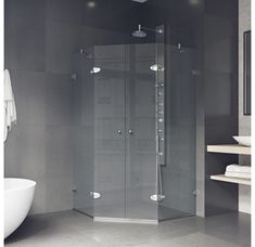 a white bath tub sitting next to a walk in shower