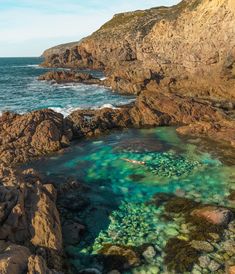 an aerial view of some rocks and water