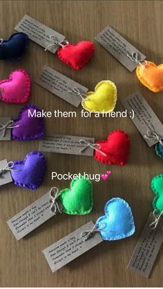 several hearts with tags attached to them sitting on a table