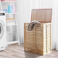 a laundry basket sitting next to a washing machine