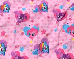 a pink blanket with hearts and pony ponies on it's sides, all over