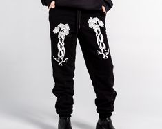 Unisex "Jogger" Style Sweatpants from Forbidden Alchemy. Designed for both comfort and style, these slim-fitting joggers feature a tapered ankle for a sleek silhouette that flatters all body types. Crafted from a premium blend of 80% cotton and 20% polyester, they offer the perfect balance of softness and durability, ensuring all-day comfort and long-lasting wear. Slim Fit: Tailored to hug your body while allowing ease of movement. Tapered Ankle: Provides a modern, streamlined look. Premium Fabr Spring Streetwear Tapered Leg Joggers, Spring Streetwear Joggers Relaxed Fit, Spring Streetwear Relaxed Fit Joggers, Relaxed Fit Joggers For Spring Streetwear, Winter Fitted Pants For Streetwear, Fitted Winter Pants For Streetwear, Fitted Pants For Winter Streetwear, Tapered Leg Sweatpants For Streetwear In Spring, Spring Streetwear Tapered Leg Sweatpants