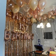 balloons and streamers are hanging from the ceiling