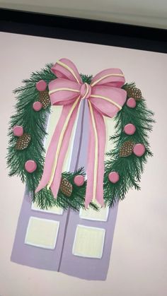 a painting of a wreath with pine cones and pink ribbon