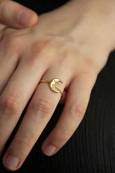 Dainty Moon Ring, delicate moon ring, Crescent Moon Ring, Celestial ring This dreamy moon ring is the perfect add to your Selene collection of stackers. These little engraved details on the moon make it come to life through stardust. Wear it everyday, everywhere. - Hand crafted in sterling silver, 22 Κ gold plating. - Band thickness: 1.6 mm. - Moon diameter: 11.4 mm x 9 mm. ♥ You can wear this jewel with this pair of hoop earrings:  https://www.etsy.com/listing/833952905/crescent-moon-earrings-h Crescent Moon Ring, Celestial Ring, Crescent Moon Earrings, Moon Ring, Moon Earrings, Delicate Rings, Stackable Rings, Minimal Design, Crescent Moon