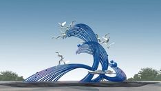 a blue sculpture with birds flying around it