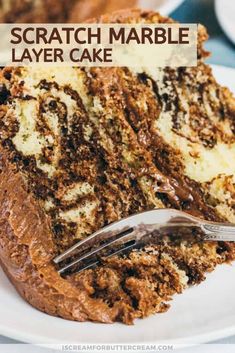 a close up of a piece of cake on a plate with a knife and fork