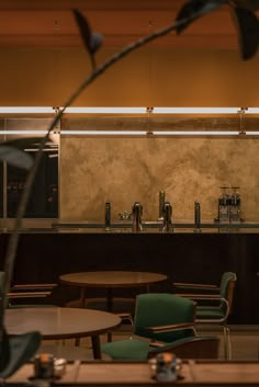 the interior of a restaurant with tables and chairs