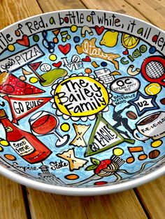 a plate with the words van erps family painted on it and pictures of dogs, cats, hamburgers, hotdogs, ketchup, and more