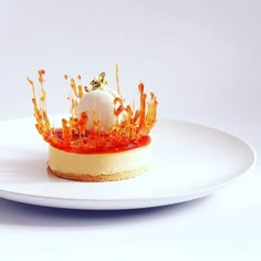 a dessert with orange sauce on a white plate