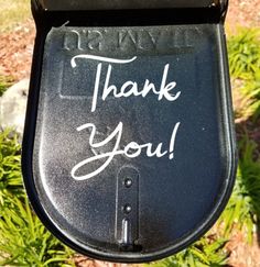 a close up of a parking meter with writing on the side and thank you written on it