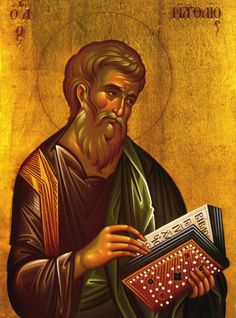 an icon of st john the baptist holding a typewriter and looking at his book