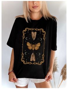 Dark academia - cottagecore t shirt with celestial moth , moon and stars in renaissance frame. - Gildan t shirt - Classic fit - 100 %cotton - Machine wash and dryer safe - Cold wash inside out, low heat tumble dryer Unisex SIZING Chart: Small:       Length 28" - Width 18"   Medium:  Length 29" - Width 20"   Large:      Length 30" - Width 22"   XL :           Length 31" - Width "24   2XL:          Length 32" - Width 26"   3XL:          Length 33" - Width 28"  All measurements are approximations. Dark Academia Cottagecore, Ren Fair, Dark Cottagecore, Luna Moth, Photo Lighting, T Shirt For Women, Shirt For Women, Dark Academia, Moth