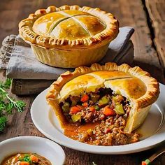 two pies with meat and vegetables on plates