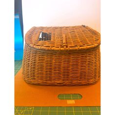 a wicker basket sitting on top of a cutting board