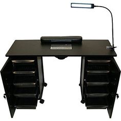 a black desk with drawers and a lamp on it's headlight is shown