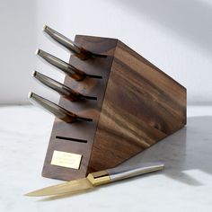 a knife block with five knives in it