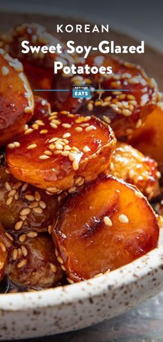 sweet soy glazed potatoes in a bowl with sesame seeds