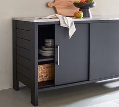 a kitchen cabinet with some plates and bowls on top of it next to a cutting board