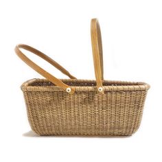 a wicker basket with two wooden handles