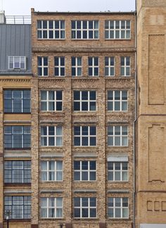 an old brick building with many windows