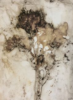 an abstract painting of a tree in brown and white colors on a marble slab surface