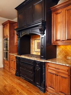 a large kitchen with wooden cabinets and granite counter tops, along with hardwood flooring