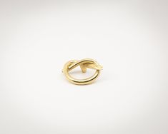 a gold ring on a white background