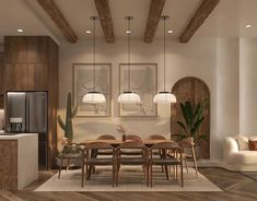 a dining room and kitchen area with wood flooring, white walls and exposed beams