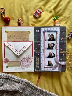 an open scrapbook with pictures and candy on the cover, along with other items