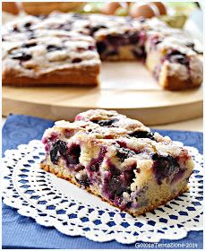 a piece of blueberry coffee cake on a plate