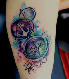 an image of a tattoo on someone's leg with the word compass and anchor in watercolor