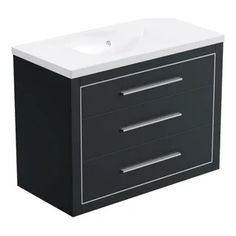 a white sink sitting next to a black cabinet