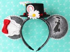 a mickey mouse ears headband with an image of a woman in a top hat