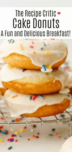 a stack of donuts with frosting and sprinkles on a cooling rack